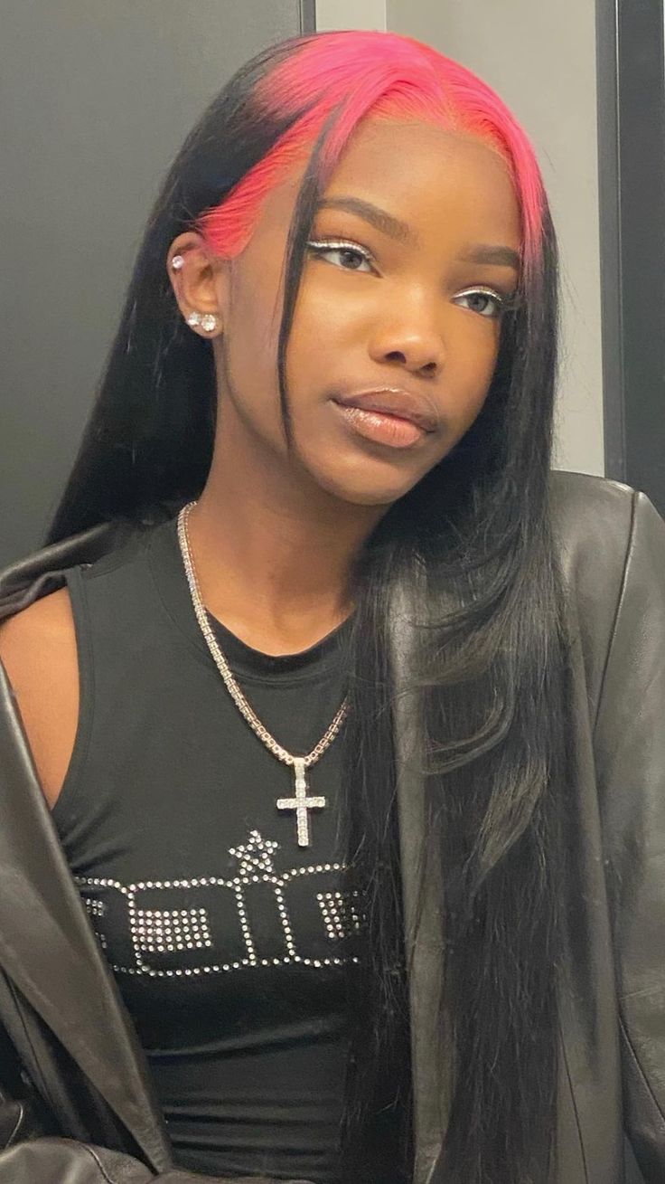 Long sleek black hair with bright fuchsia ghost roots and face-framing tendrils.