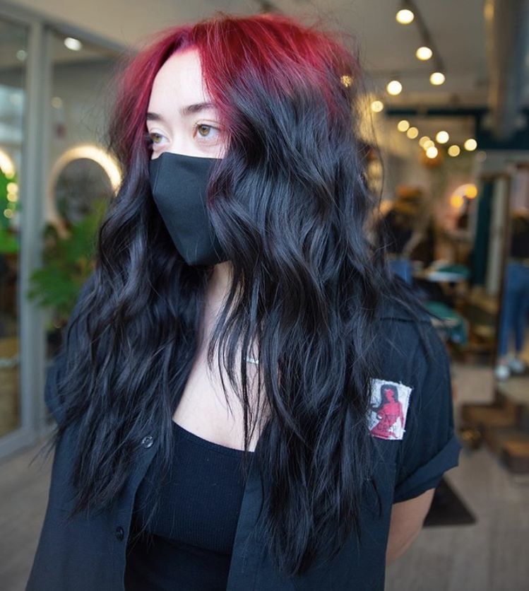 Long black waves with wine-red ghost roots and a soft middle part.
