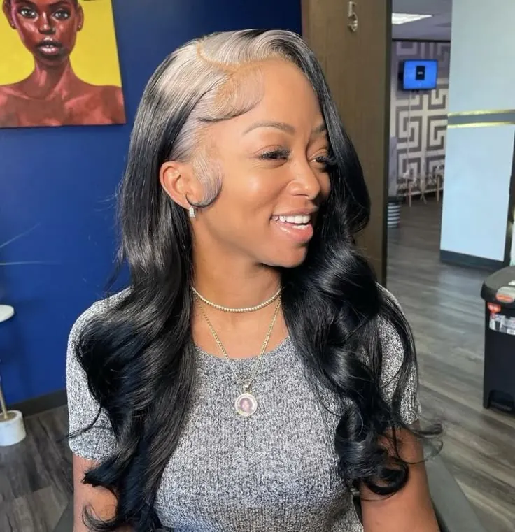 Long black body waves with silver-white ghost roots and laid baby hairs.