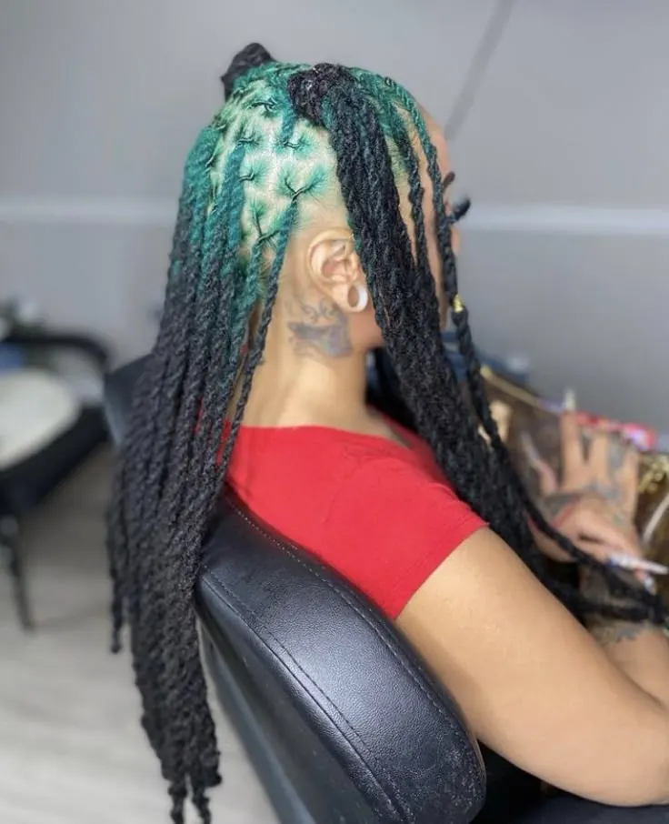 Black hair with Teal Green ghost roots, Long Locs, Side Profile.